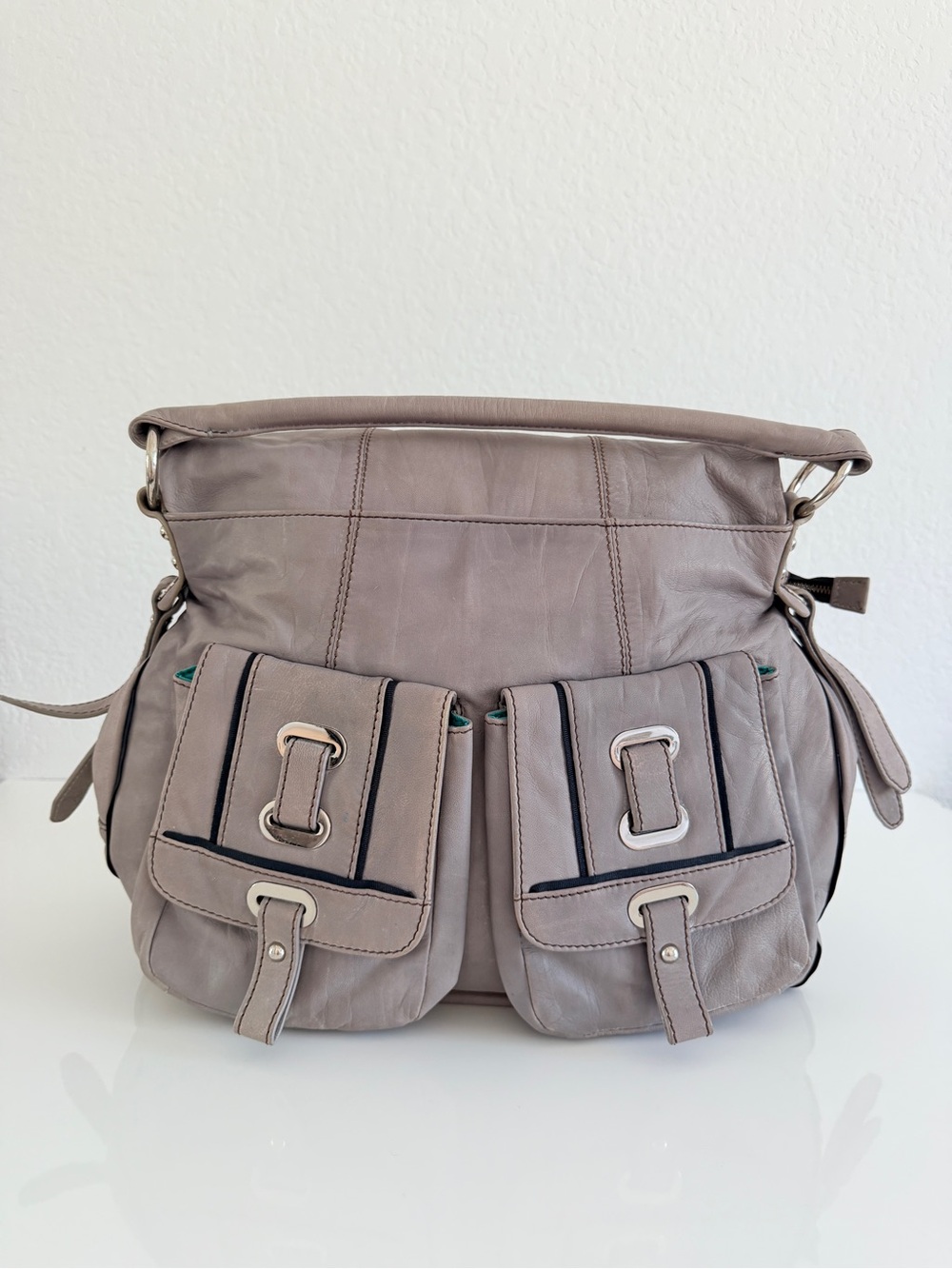 Oryany fold over front pocket leather bag